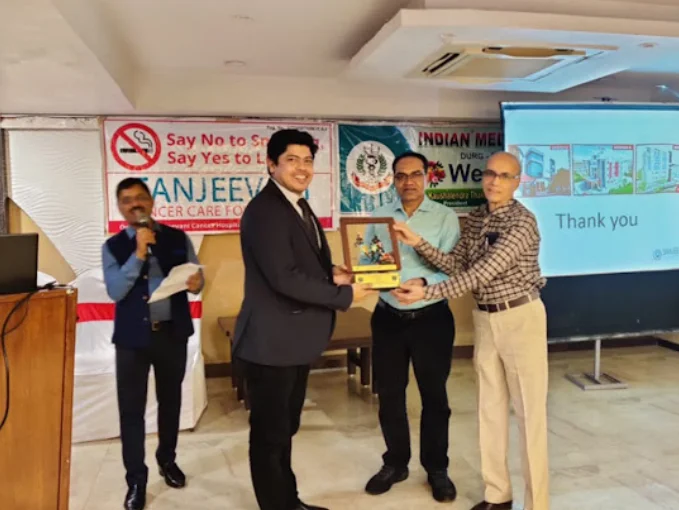 dr avinash tiwari palliative medicine specialist being awarded in awareness event, health expert forum