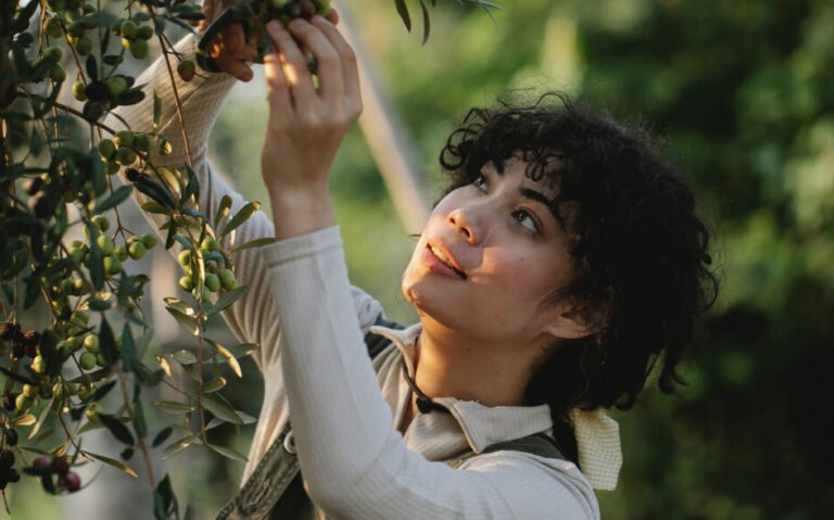 woman picking fruit for natural health remedy Nutraceuticals