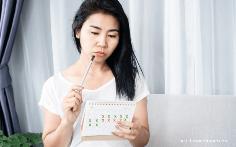 woman with amenorrhea (no periods) with a calendar marked with period dates.